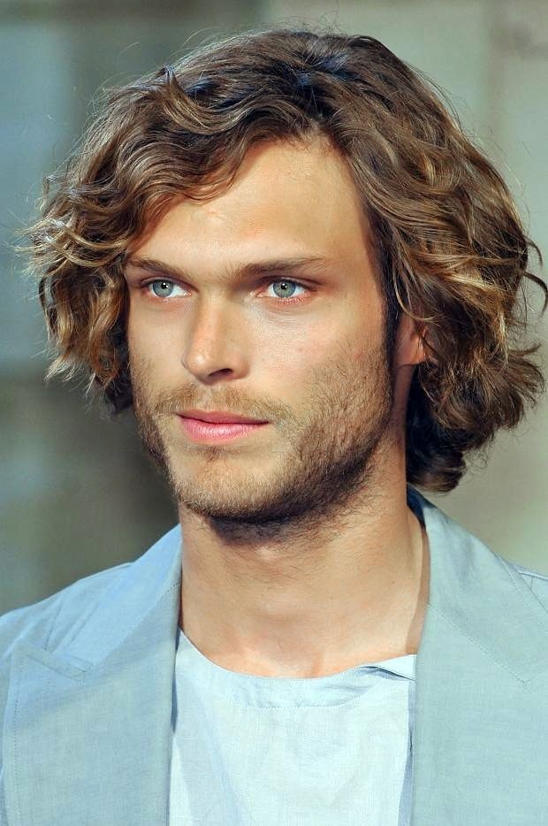 Mid length, curly hairstyle for men