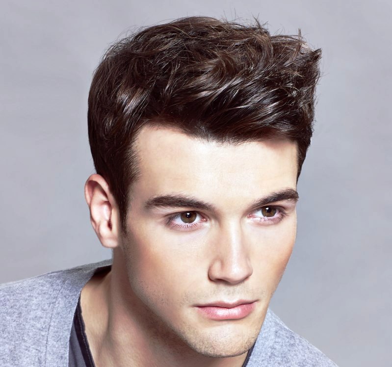Short men's haircut with a slick wave