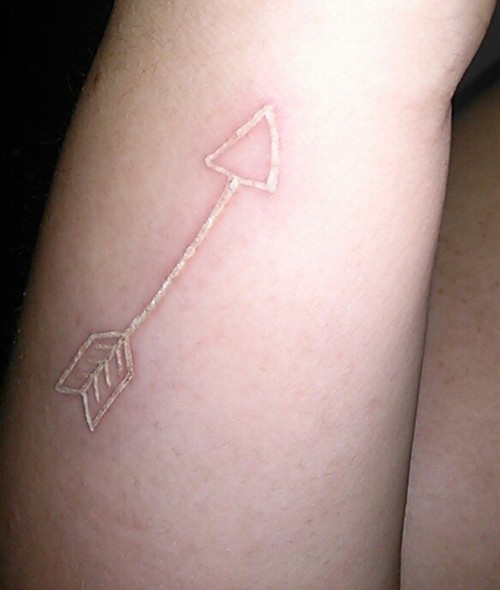  white arrow tattoo