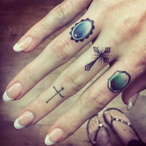 cross tattoos on finger