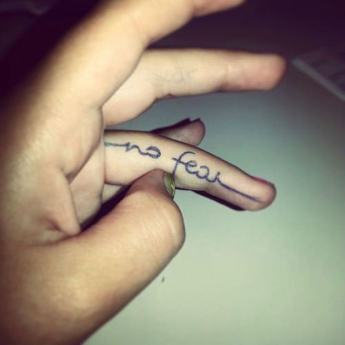 inner finger tattoos