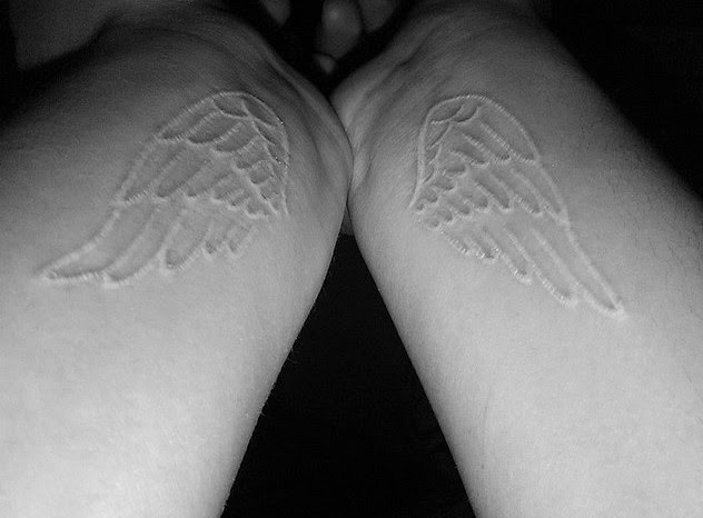 white tattoo wings