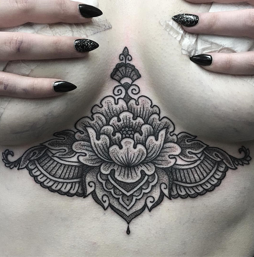 lotus flower tattoo sternum