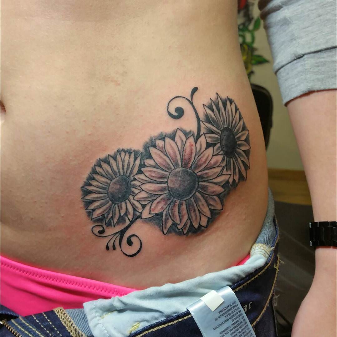 sunflower tattoo on hip