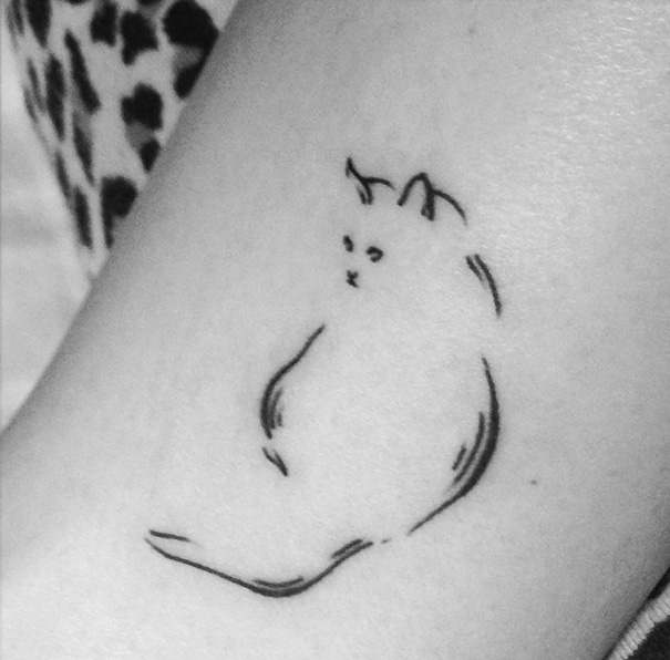  white cat tattoo