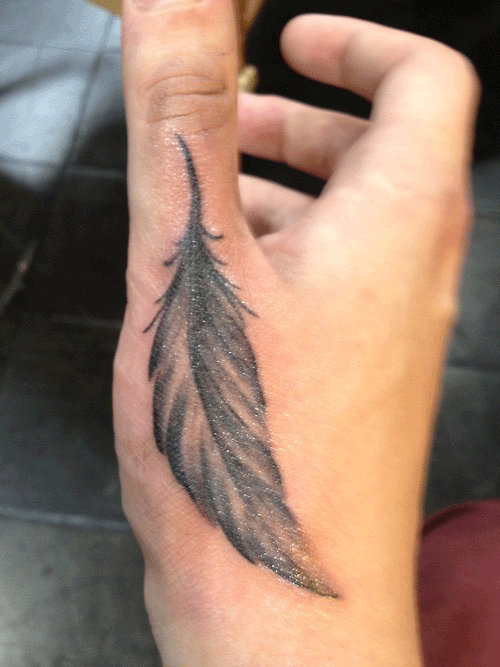 feather hand tattoos
