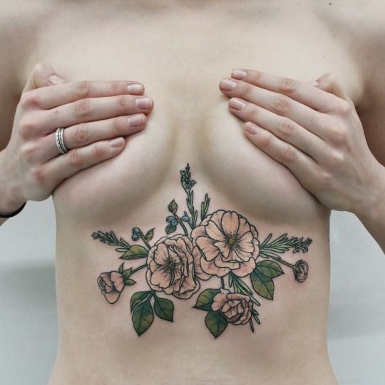 flower sternum tattoo